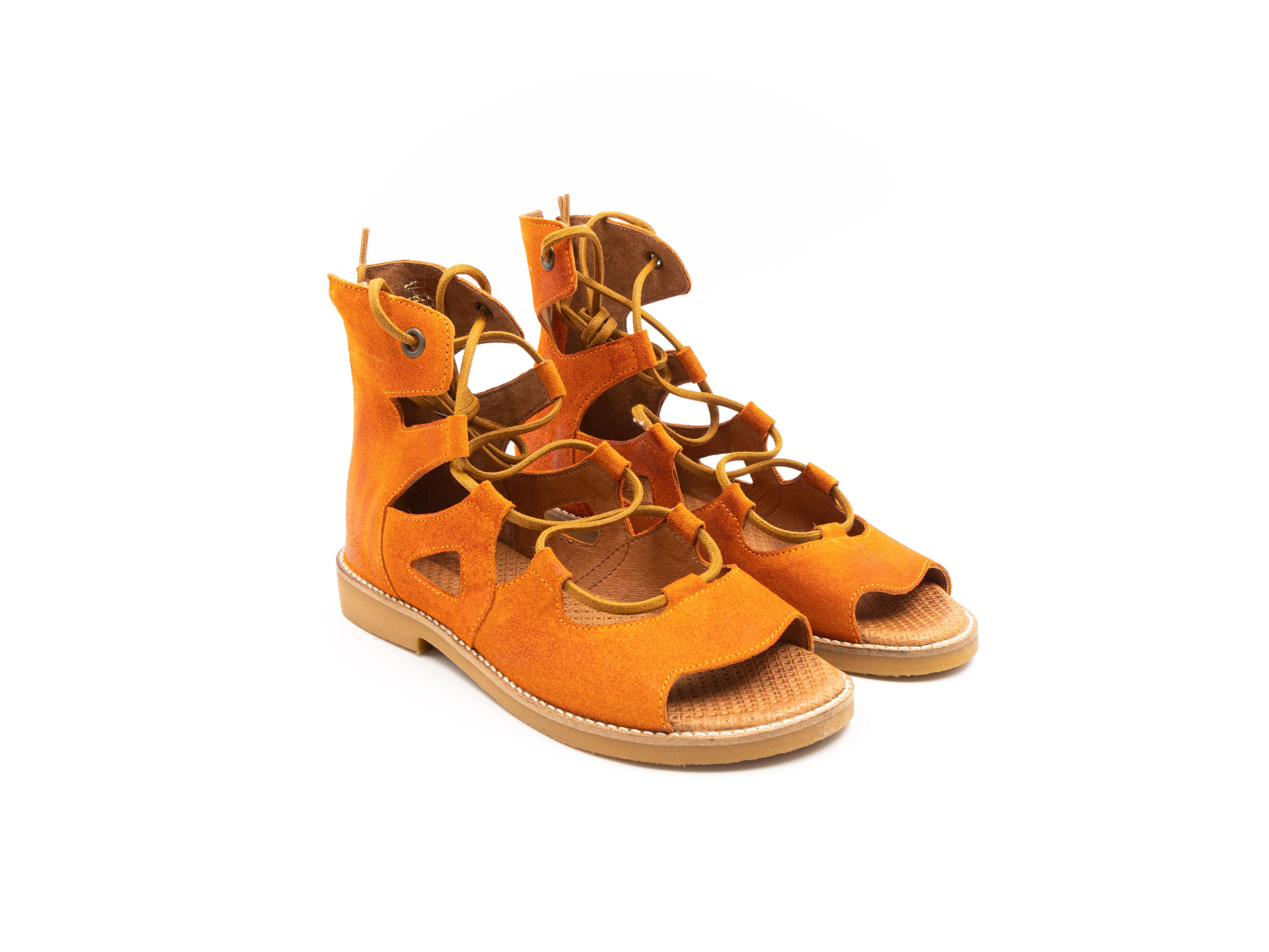 Roman-style sandals in orange tones.