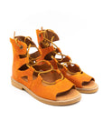Roman-style sandals in orange tones.