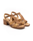 Heeled sandals in brown and gold tones.