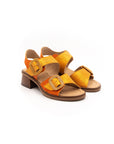 Sandals with small heels in shades of orange.