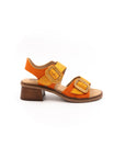Sandals with small heels in shades of orange.