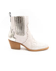 A white ankle boot with a heel, featuring a side zipper and decorative stitching detail.
