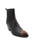 Black leather boot with patterned toe cap on a white background