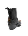 Black boot with a brand logo on a white background
