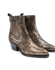 Metallic bronze boot on a white background