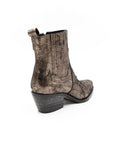Metallic bronze boot on a white background