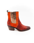 Boot with orange side panel on a white background