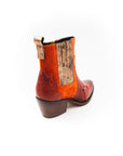 Boot with orange side panel on a white background