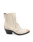 White ankle boot with black heel on a white background