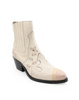 White cowboy boot with black embroidery on a white background