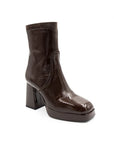 Brown ankle boot with platform sole on a white background