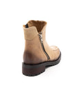 Beige boot with a zipper on a white background