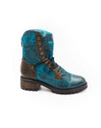 Blue leather boot with brown accents on a white background