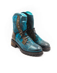 Pair of blue and black leather boots on a white background
