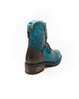 Blue and brown leather boot on a white background