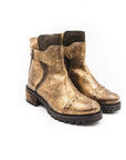 Pair of brown leather boots on a white background