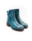 Pair of blue rain boots on a white background