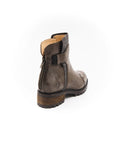 Brown leather boot with a wooden sole on a white background