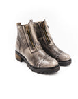 Pair of gray leather boots with zippers on a white background