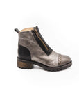 Gray suede ankle boot with black accents on a white background
