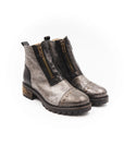 Pair of gray ankle boots with black accents on a white background