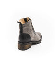 Gray ankle boot with black sole on a white background