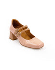 A pink Mary Jane style heel with a squared toe and buckle strap.