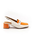 A white and orange two-tone patent leather moccasin style heel with an adjustable back strap.