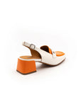 A white and orange two-tone patent leather moccasin style heel with an adjustable back strap.