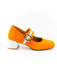 A bright orange Mary Jane style shoe with a squared toe and a 4cm heel, featuring a white buckle and a removable insole.