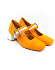 A bright orange Mary Jane style shoe with a squared toe and a 4cm heel, featuring a white buckle and a removable insole.