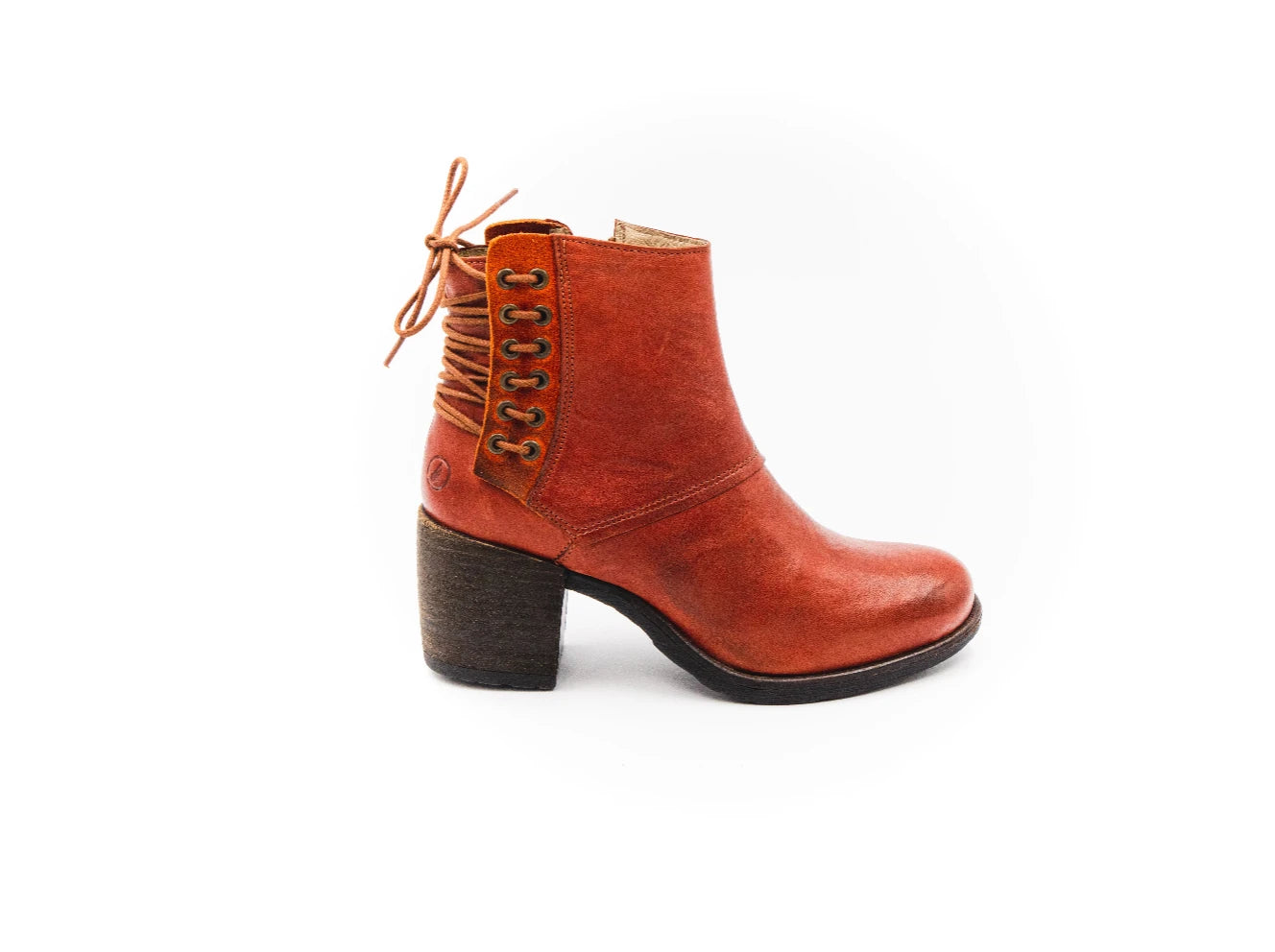 Brown leather boot with a block heel on a white background