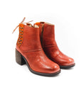 Pair of brown leather boots on a white background