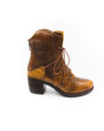 Brown leather boot with lace-up design on a white background