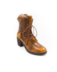 Brown leather boot with lace-up design on a white background