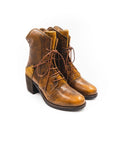 Pair of brown leather boots with lace-up design on a white background