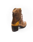 Brown leather boot on a white background