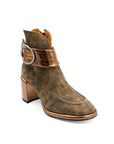 Brown leather boot with gold accents on a white background