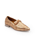 Gold loafer shoe on a white background