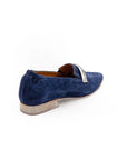Blue suede loafer with jute sole on a white background