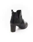 Black leather boot on a white background
