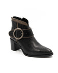 Black ankle boot with decorative strap on a white background