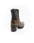 Brown leather boot with a zipper on a white background