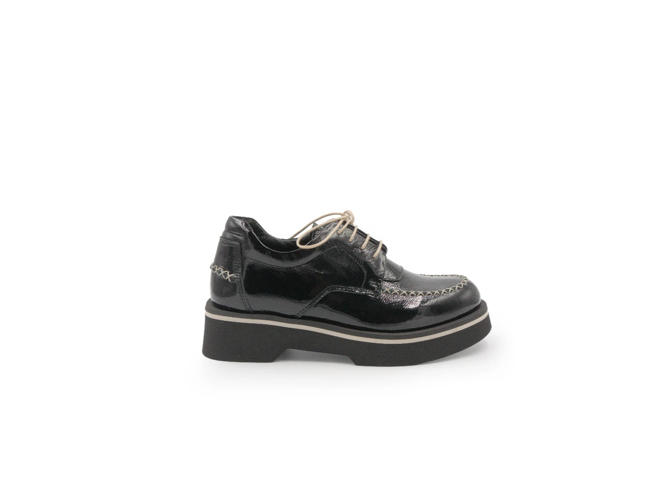 Black leather brogue shoe on a white background