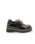 Black leather brogue shoe on a white background