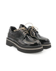 Pair of black leather shoes on a white background