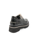 Black platform shoe on a white background
