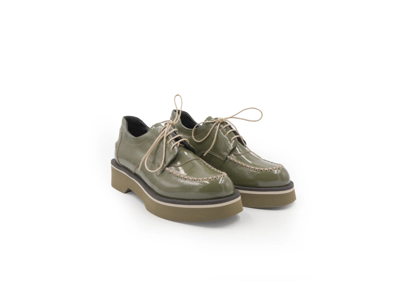 Pair of green leather shoes on a white background