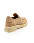 A beige colored shoe with a light foam sole and leather upper, viewed from the side.