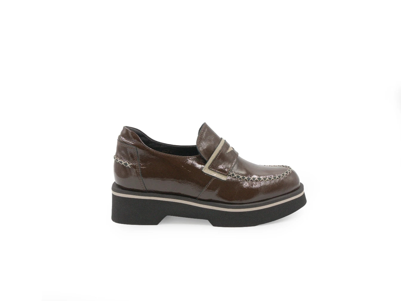 Brown leather shoe with a platform sole on a white background